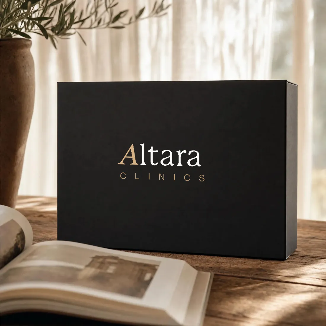 An Altara Clinics welcome box on a sunlit timber table